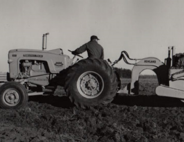 Old Photo From 1953 of a Tractor Pulling a Scraper